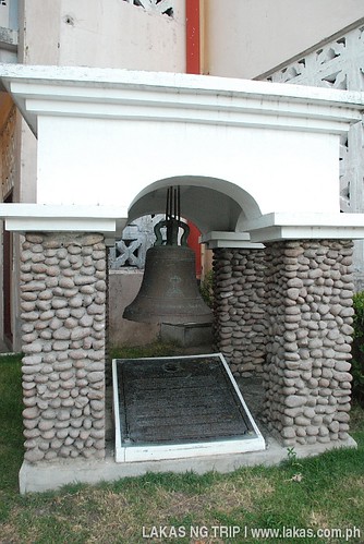 Bell at the side of Banton Church with metal plaque describing its history at Banton Island, Romblon