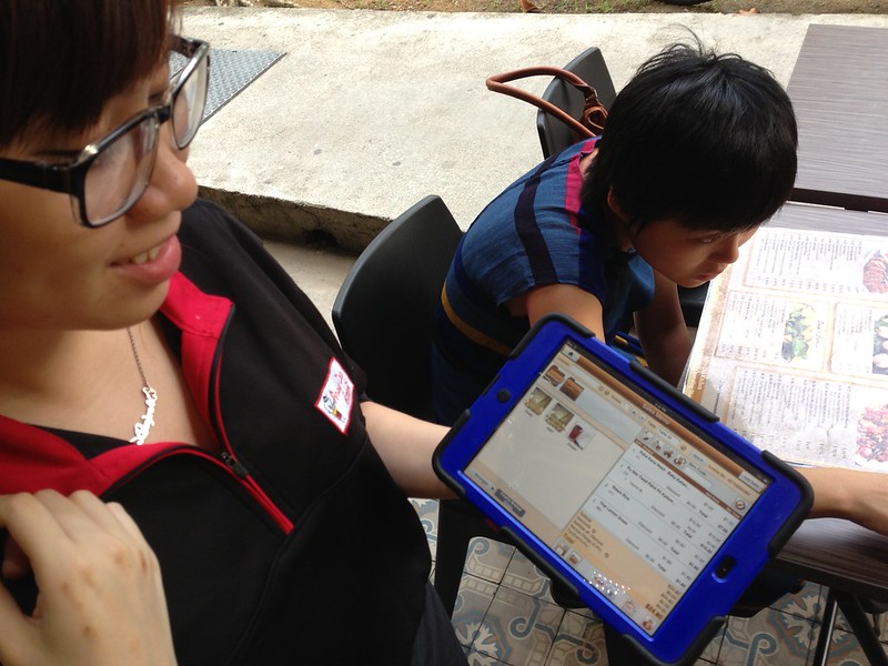 Living in the future. Thai waitress took order with iPad