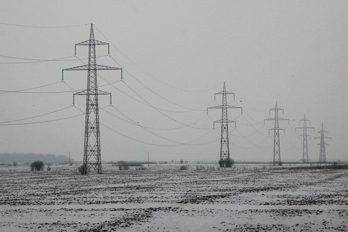 Transmission lines in the snow covered Romanian countryside