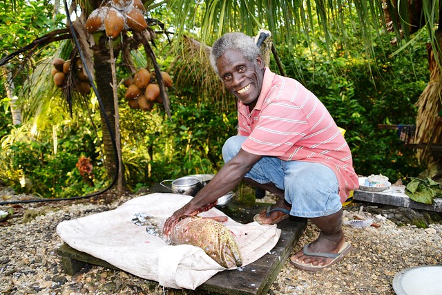 Jacob Sam Hioau prepares an orange-spotted grouper for dinner. Fish is the primary animal-source food for rural communities in Solomon Islands. Photo by J. van der Ploeg