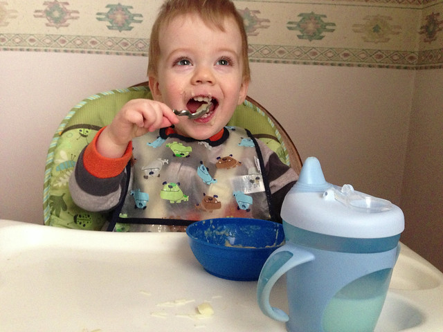 Overjoyed to be Feeding Himself with a Spoon