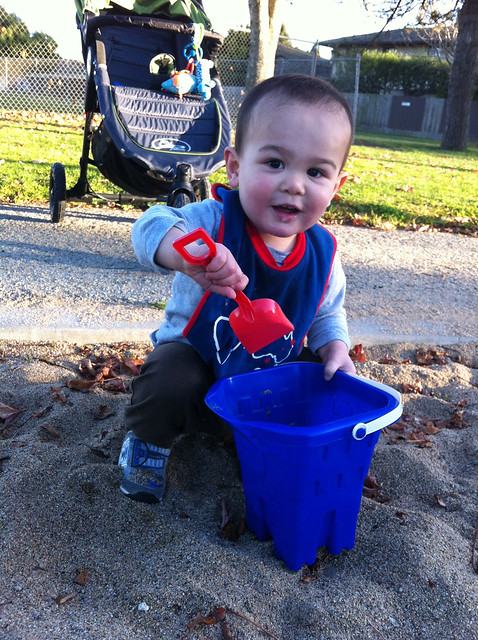 Playing at park with bucket
