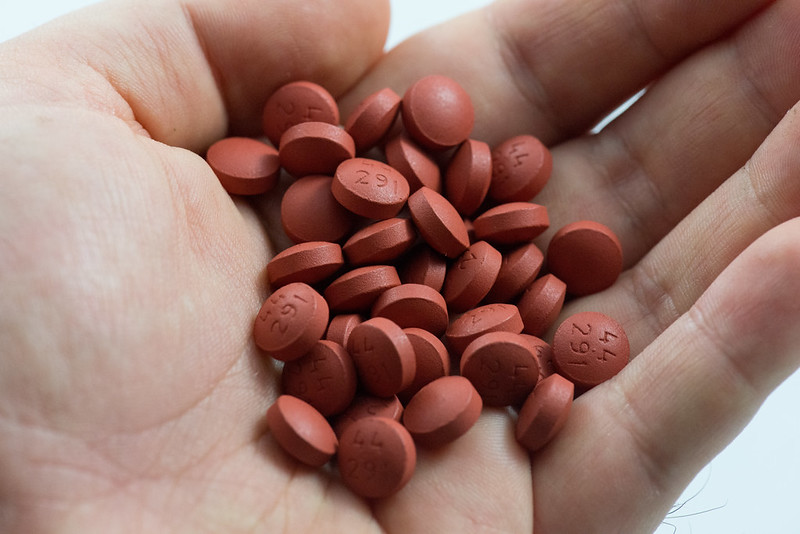 Ibuprofen tablets in palm of hand