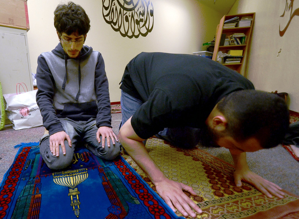 SF State's Muslim Student Association (MSA) members Moaan Ahmed, left, and Ali Al-Arabi, right, pray in room C-139 in the lower level of the Cesar Chavez Student Center on Monday, April 29, 2013. Photo by Frank Leal / Xpress