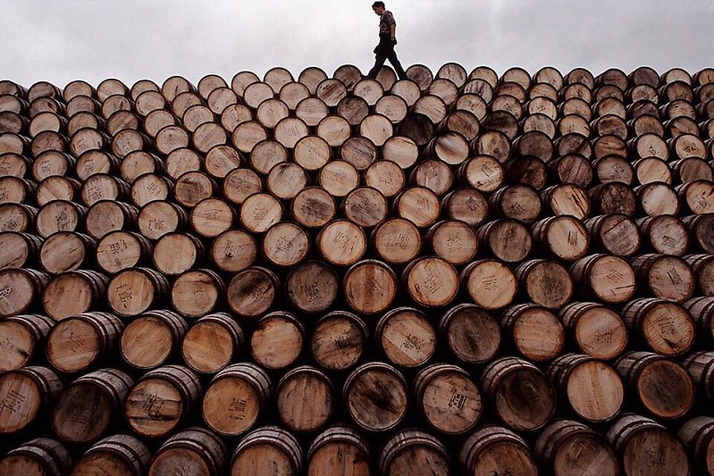 Mountains of whisky casks reach to the sky at Speyside Cooperage in Scotland. Workers here live in a world of craft skills rarely carried on today. Thankfully it's a skill much needed and so won't go away soon. @natgeo @natgeocreative #scotland