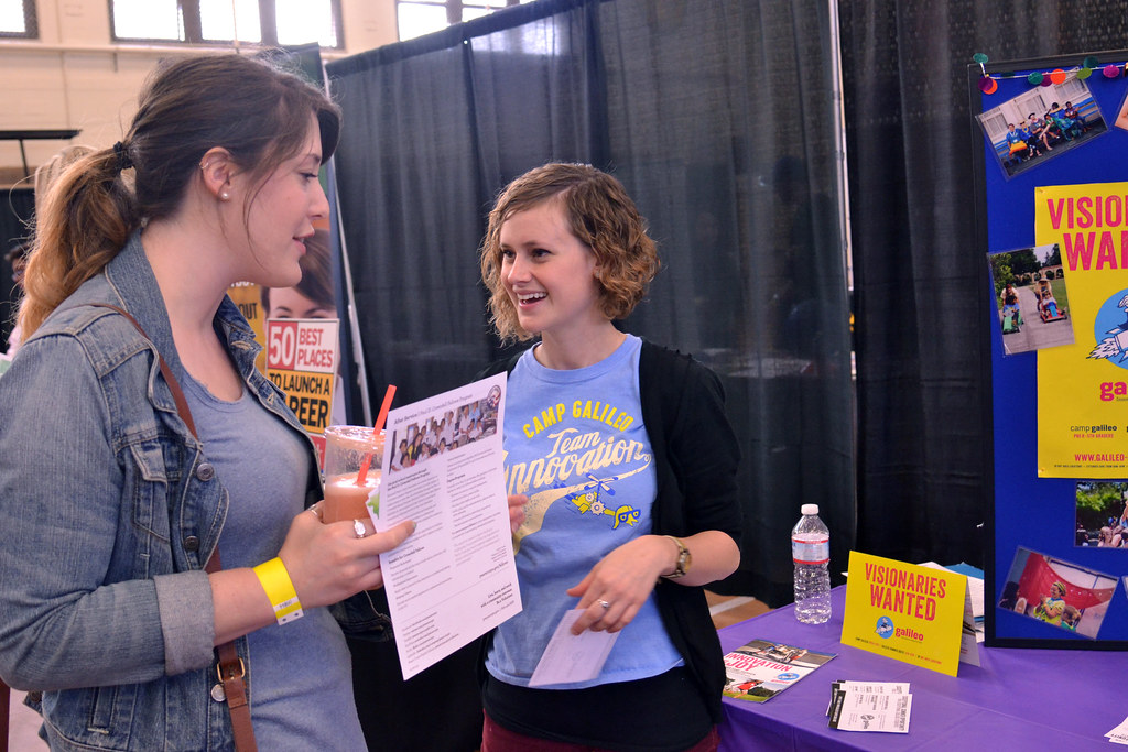 Aubrea Felch talks with SF State student Haley Margolin about Galileo Innovation Camps for Kids at the SF State spring job fair on Friday, April 12, 2013.  Photo by Samantha Benedict / Xpress