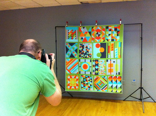 Bill photographing the PMQG Graphic quilt for the Quilt Index!