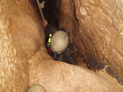 Helen thrutching her way up the tight pitch head that leads into the final chamber Image