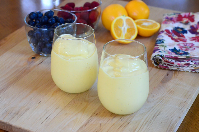 The smoothie is poured into two glasses.