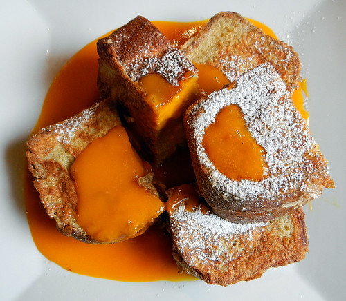 French Toast filled with Banana Cream & Cheese and slathered in Mango Sauce