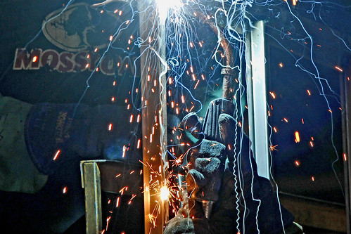 shootingthewestphotographysymposium winnemuccaatwork carryontrailercorp welder welding sparks weldinggloves weldingsparks charliewambekephotography wambekewambeke wambekewambekephotographyarttextiles canoneos60ddslrphotograph