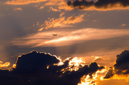 light sky clouds plane sunrise airplane rays