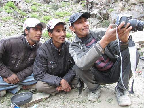 Our porters from Tikat admiring a photo of themselves