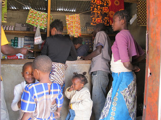Women collecting Kit Yamoyos from Joy's shop