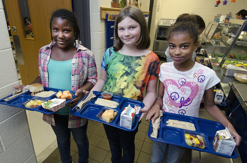 School lunch staff and students enjoy the new school lunch menu created to meet the new standards at the Yorkshire Elementary School in Manassas, VA on Friday, Sept. 7, 2012. USDA photo by Lance Cheung. 