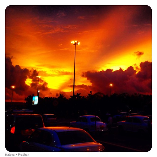 city light sunset sky orange cars lamp yellow clouds gold airport dusk lamppost hues cochin flaming malayapradhan malayakpradhan