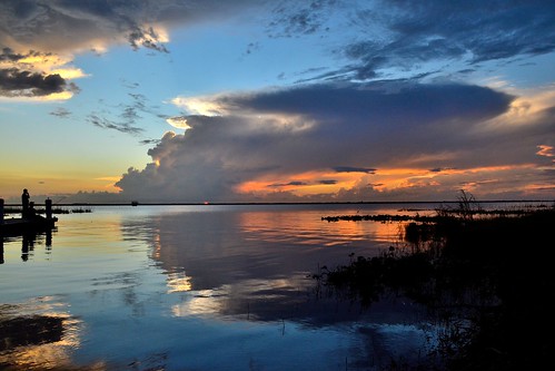 sunset sky sun lake water clouds