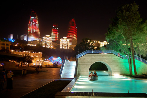 water night boat view towers baku azerbaijan flame