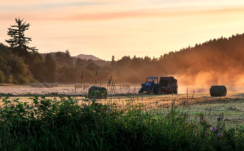 sunset oregon shadows farming farmland farmer hay bales baler