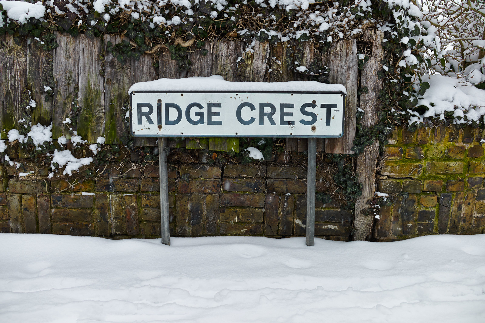 Snowy sign for Ridge Crest