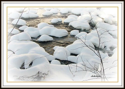winter snow reflection river rocks mounds millstream