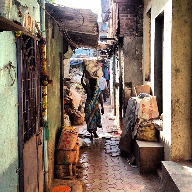 Woman in Dharavi, Mumbai, India. Picture published by Thomas Galvez on Flickr under a CC BY 2.0 license.
