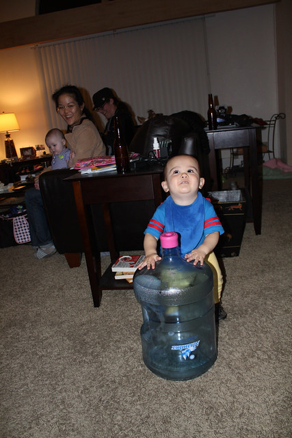 Playing with his water bottle drum