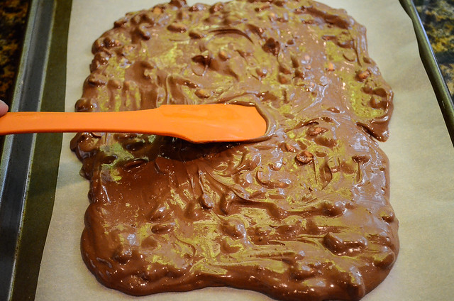 A spatula smooths out the chocolate mixture.