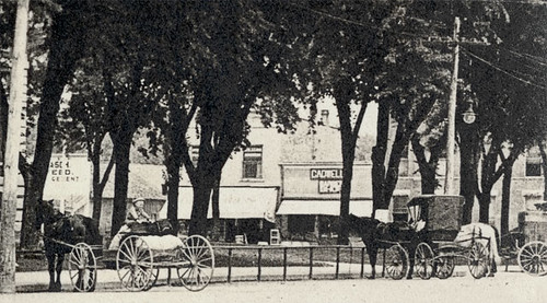 horses people usa signs history boys kids buildings advertising children awning indiana streetscene transportation shops courthouse storefronts grocery crownpoint waterpump buggy clocks buggies businesses lakecounty barbers realphoto hoosierrecollections