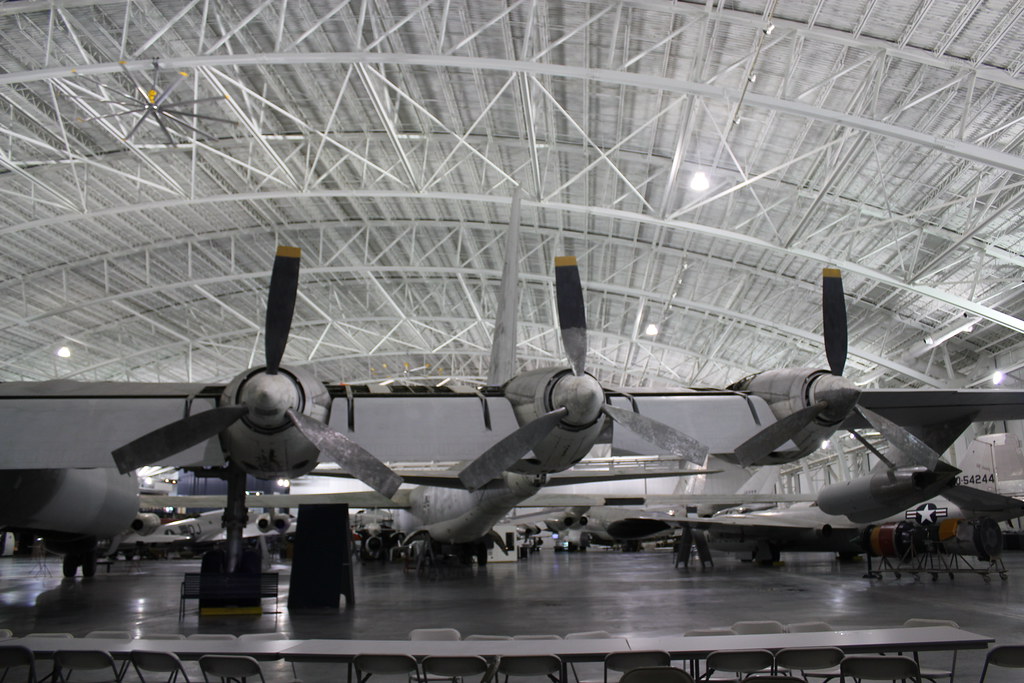 Three vintage B-36 fighter planes sit on display in a giant airplane hanger at the Strategic Air Command Museum in Nebraska.
