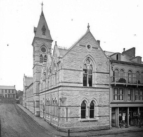 church gothicrevival shops phospho guano phosphoguano seeds farmseeds hardware brushes buckets kettles coopers dippingpowder balcony stereoscopiccollection stereopairs stereographicnegatives stereoscope jamessimonton frederickhollandmares johnlawrence lawrencecollection 19thcentury mcgareltownhall larne antrim ireland northernireland ulster frenchgothic alexandertate charlesmcgarel uppermainstreet lowercrossstreet frillyitus nationallibraryofireland locationidentified