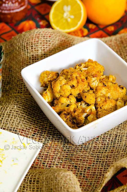 This in an intensely flavorful appetizer of baked Thai Curry Cauliflower Bites with a creamy coconut lime aioli. Allergy-friendly, pretty healthy, and VERY tasty! #vegan #vegetarian #appetizer #thai #cauliflower