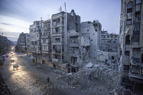 Dar Al-Shifa hospital (seen partially to the right of the frame) was bombed by a plane. The hospital had been bombed and shelled more than 20 times and was clearly a target for the Assad forces. The hospital had turned into a symbol of resistance.