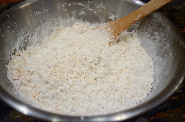 Powdered sugar and Rice Krispies mixed together in a bowl.