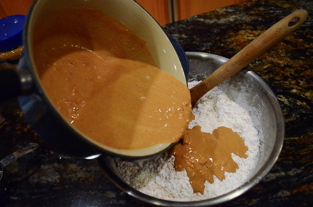The peanut butter mixture is poured over the Rice Krispies.