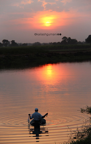 sunset lake water fisherman