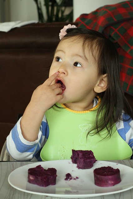 Caya eating Stoke's Purple Sweet Potatoes