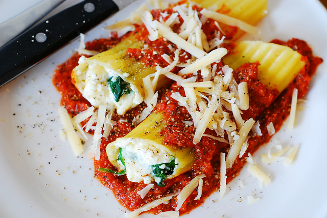 Stuffed manicotti pasta shells with ricotta cheese and spinach filling