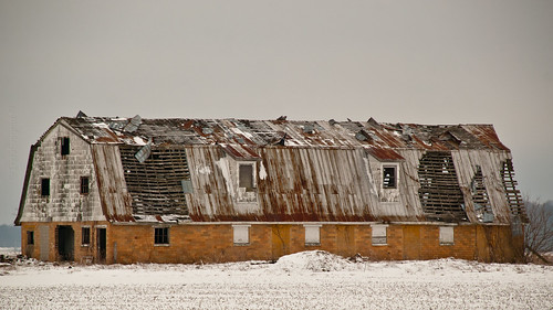 old winter snow abandoned barn rural ruins decay metalroof glazedbrick cornstubble