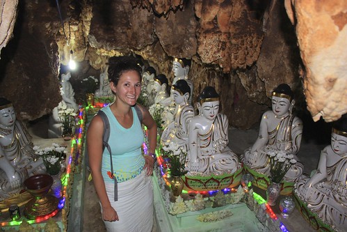 Lina in a cave full of Buddhas