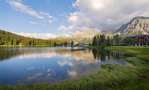 town lake surface reflection sky clouds forest houses mountains alps wideangle arosa nikon d800 switzerland