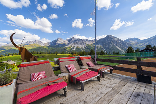 wideangle lying beds chairs lounging deck terrace mountains restaurant alps tenniscourse sky clouds trees landscape scenery view pretty arosa nikon d800 switzerland