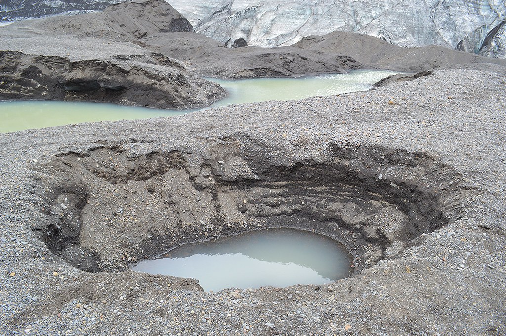 The Big Sink Hole Craters And Large Holes Pepper The Lands
