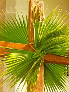 A cross decorated with palm branches