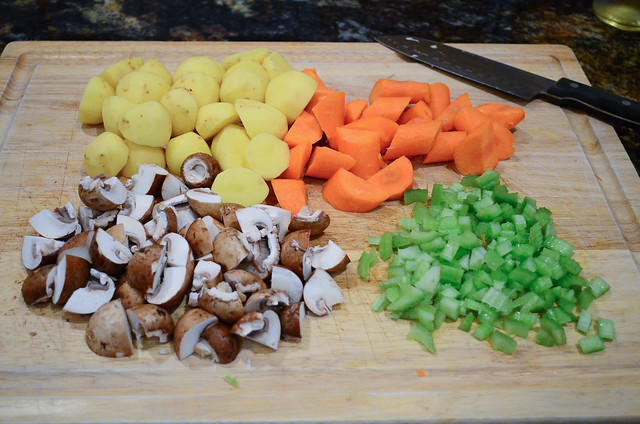 The vegetables are chopped up on a cutting board.