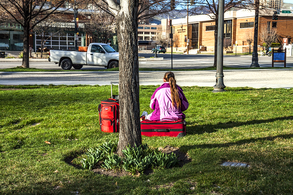 Woman-on-grass-with-two-suitcases--Salt-Lake-City