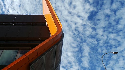 blue sky orange abstract bus station metal clouds facade zoom streetlamp curves central samsung adelaide depot theen grotestreet