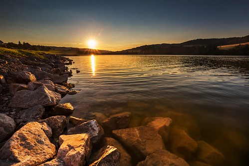 stone reservoir dam yellow weather village tree sunny sunlight sundown water sunset sun sky season scenic scenery scene rural plant outdoors outdoor orange nature natural light landscape image idyllic green grass forest field evening countryside country colorful color cloudy beauty beautiful background