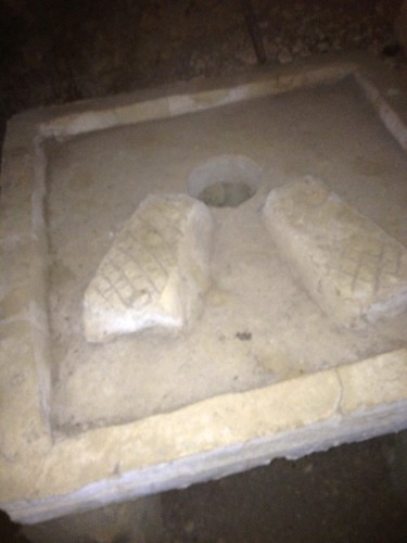 cave squat toilet. very small hole