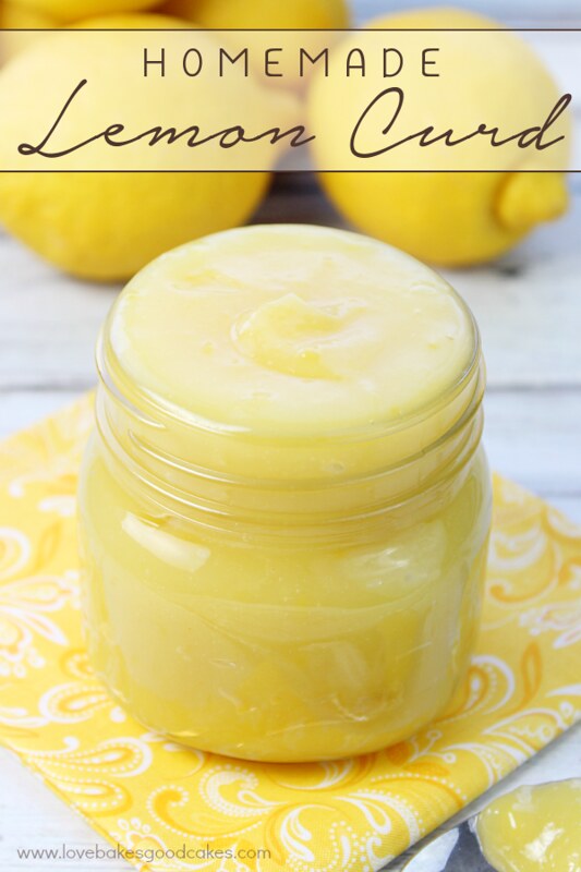 Homemade Lemon Curd in a jar with fresh lemons.
